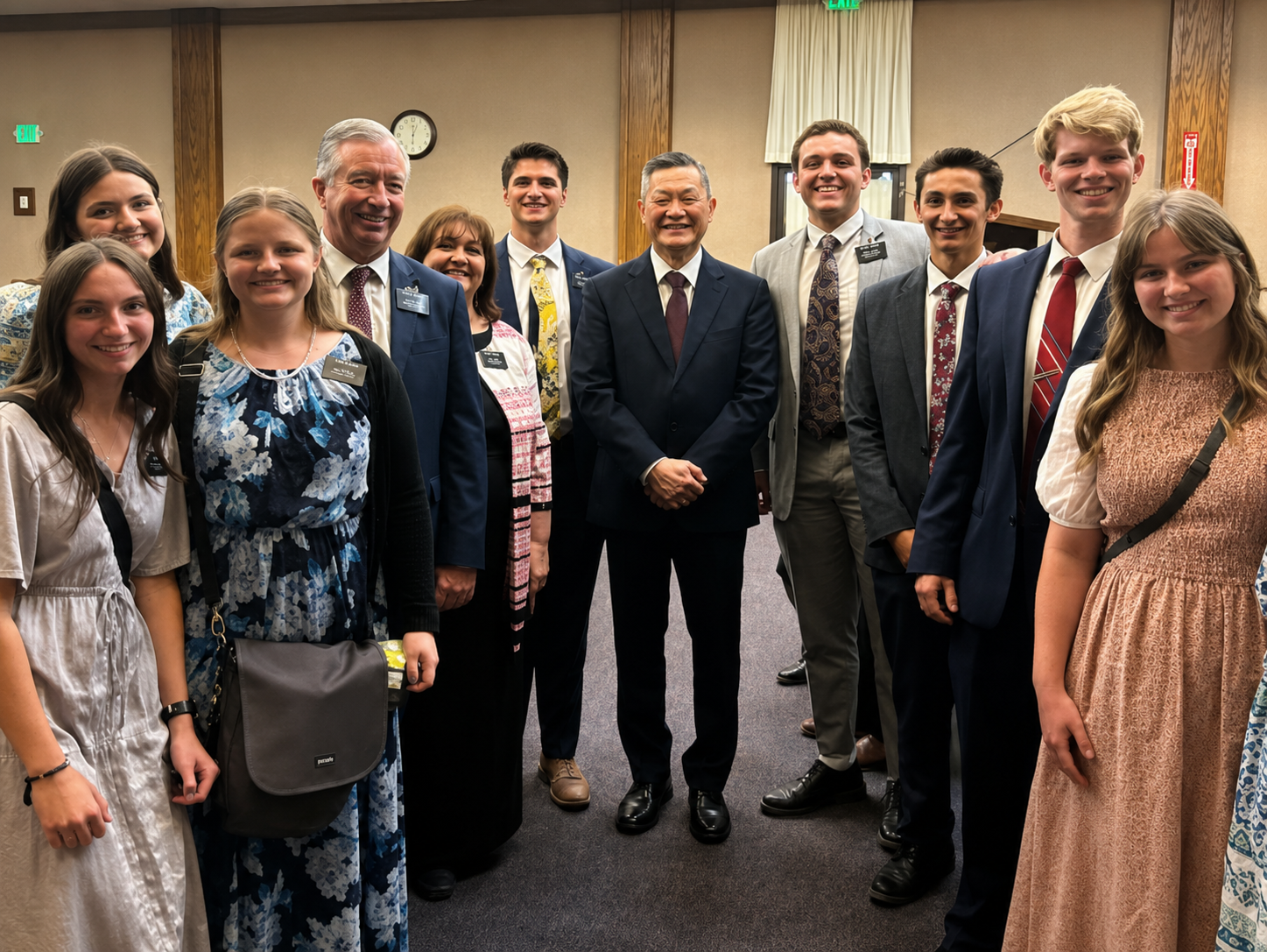 Smiling formal group portrait in meeting room
